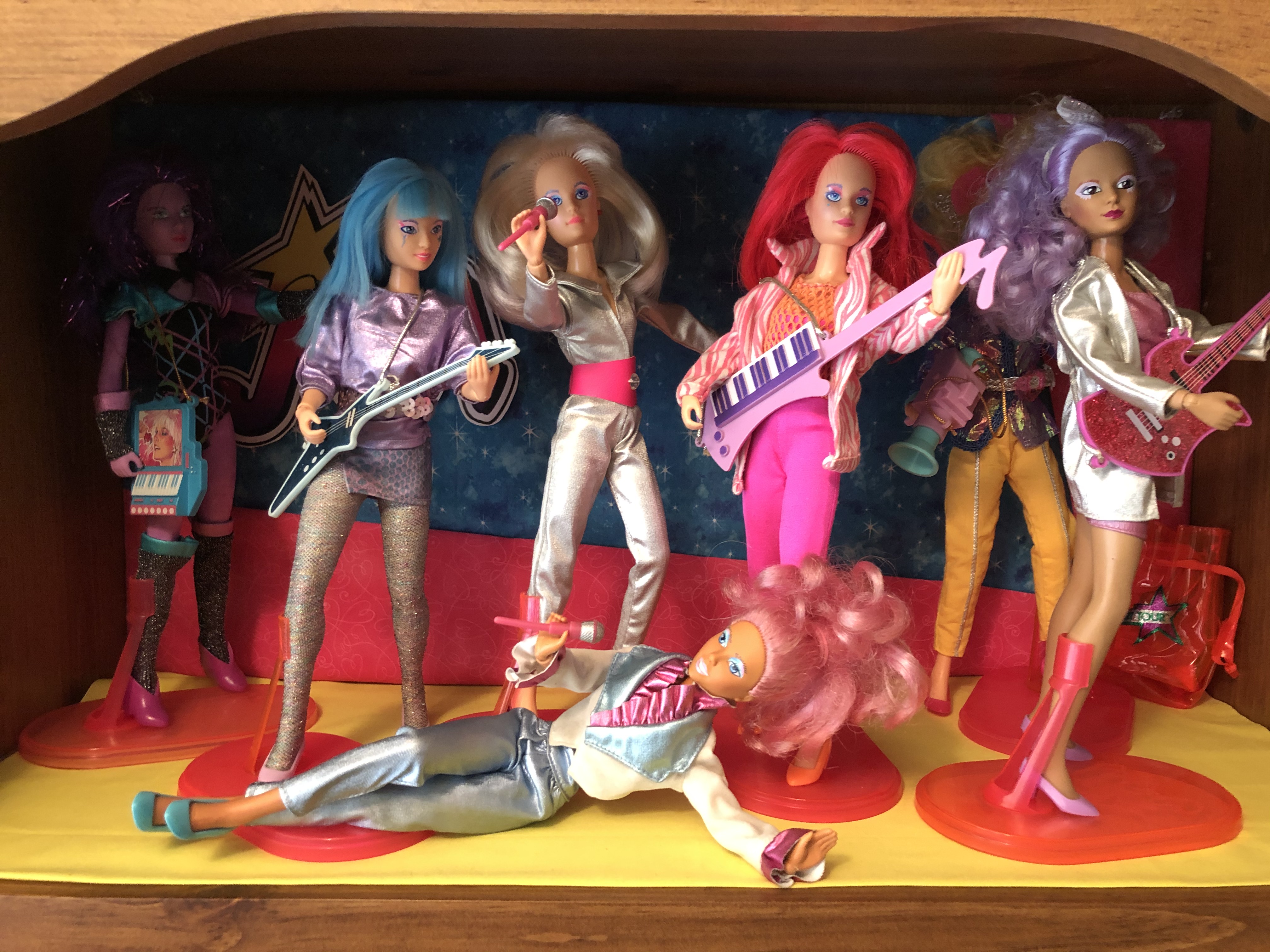 Jem and the Holograms preening in full rockstar mode as only they can